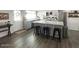 Open kitchen featuring a large island with seating, stainless steel appliances, and plenty of counter space at 694 W Park Ave, Chandler, AZ 85225