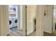 Laundry room features a washer, dryer, shelves, baskets, and cabinets at 694 W Park Ave, Chandler, AZ 85225