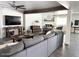 Bright living room boasts an open layout, wood beam, and seamlessly connects to the dining area at 694 W Park Ave, Chandler, AZ 85225