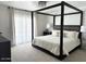 Spacious main bedroom with a canopy bed, neutral decor, and bright, airy feel at 694 W Park Ave, Chandler, AZ 85225