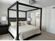 Elegant main bedroom featuring a stylish canopy bed, plush bedding, and neutral tones at 694 W Park Ave, Chandler, AZ 85225