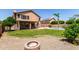 Picturesque backyard with a pool, patio, and lush landscaping at 7179 W Surrey Ave, Peoria, AZ 85381
