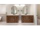 Dual sink bathroom with modern fixtures and ample cabinet space at 7179 W Surrey Ave, Peoria, AZ 85381
