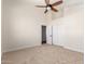 Bright bedroom with carpet, fan, vaulted ceiling and a large closet at 7179 W Surrey Ave, Peoria, AZ 85381