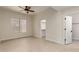Bedroom with tile flooring and a view into a walk-in closet at 7179 W Surrey Ave, Peoria, AZ 85381