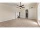 Large bedroom featuring a ceiling fan and adjoining spaces at 7179 W Surrey Ave, Peoria, AZ 85381