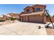 View of front of two story home with basketball hoop on a sunny day at 7179 W Surrey Ave, Peoria, AZ 85381