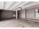Spacious garage with concrete flooring and ample storage space at 7179 W Surrey Ave, Peoria, AZ 85381
