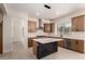 Stylish kitchen with island, modern fixtures, stainless steel appliances and plenty of counter space at 7179 W Surrey Ave, Peoria, AZ 85381
