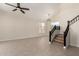 Bright, open living room with high ceilings, tiled floors, and a staircase at 7179 W Surrey Ave, Peoria, AZ 85381