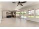 Open living area featuring pool views, backyard access, modern kitchen, and plenty of natural light at 7179 W Surrey Ave, Peoria, AZ 85381