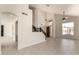 Spacious living room with staircase, large windows, and tile flooring for an open, bright feel at 7179 W Surrey Ave, Peoria, AZ 85381