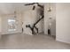 Open floor plan living room with staircase, chandelier and views of the pool at 7179 W Surrey Ave, Peoria, AZ 85381