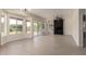 Bright living room with large windows, sliding glass doors, and fireplace feature creating comfortable ambiance at 7179 W Surrey Ave, Peoria, AZ 85381