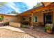 Charming covered back porch featuring an outdoor seating area and lovely brick flooring at 7202 N 16Th Dr, Phoenix, AZ 85021