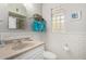 This bathroom offers modern styling, a built-in mirror, and a classic sink at 7202 N 16Th Dr, Phoenix, AZ 85021
