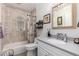 This charming bathroom has a tiled shower/tub, neutral colors, and a window for natural light at 7202 N 16Th Dr, Phoenix, AZ 85021