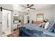This bedroom features carpet, a ceiling fan, light-gray walls, and an ensuite bath at 7202 N 16Th Dr, Phoenix, AZ 85021