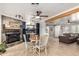Inviting dining area featuring a stylish bar, fireplace, and seamless flow to the living room at 7202 N 16Th Dr, Phoenix, AZ 85021