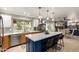 Spacious kitchen featuring a large island with seating and access to the dining and living areas at 7202 N 16Th Dr, Phoenix, AZ 85021