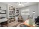 This office offers custom built-ins, a ceiling fan, hardwood floors, and natural light at 7202 N 16Th Dr, Phoenix, AZ 85021