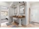 Bathroom featuring dual bowl sinks, granite countertops, and an attached bedroom at 7210 N 17Th Ave, Phoenix, AZ 85021