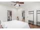 Cozy bedroom with carpet and fan and view through doors to other rooms at 7210 N 17Th Ave, Phoenix, AZ 85021