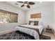 Cozy bedroom featuring a ceiling fan, neutral colors, and wooden window blinds at 7210 N 17Th Ave, Phoenix, AZ 85021