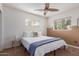 Bedroom featuring natural light, a ceiling fan, and a calming color palette at 7210 N 17Th Ave, Phoenix, AZ 85021