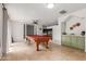 A view of the game room, complete with a pool table, kitchenette, and neutral walls at 7210 N 17Th Ave, Phoenix, AZ 85021