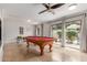 Bright game room featuring a pool table and sliding doors that let in natural light at 7210 N 17Th Ave, Phoenix, AZ 85021