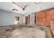 Large garage with storage cabinets and side access door at 7210 N 17Th Ave, Phoenix, AZ 85021