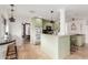 Charming eat-in kitchen featuring an island, granite countertops, and complementary pendant lighting at 7210 N 17Th Ave, Phoenix, AZ 85021