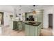 Charming eat-in kitchen featuring an island, granite countertops, and complementary pendant lighting at 7210 N 17Th Ave, Phoenix, AZ 85021