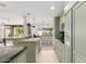 Charming eat-in kitchen featuring an island, granite countertops, and complementary pendant lighting at 7210 N 17Th Ave, Phoenix, AZ 85021