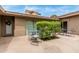 Private patio area featuring outdoor seating, neutral stucco walls and a glimpse of Arizona living at 7210 N 17Th Ave, Phoenix, AZ 85021
