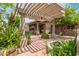 Charming patio space with pergola and lush landscaping at 7210 N 17Th Ave, Phoenix, AZ 85021