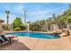 Inviting pool area with rock accents and lush tropical landscaping at 7210 N 17Th Ave, Phoenix, AZ 85021