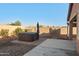 Backyard featuring a hot tub, an outdoor shower, and stone landscaping at 7577 S Towel Creek Dr, Gold Canyon, AZ 85118