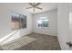 Bedroom with carpet, a ceiling fan, and a window with a view of the outside at 7577 S Towel Creek Dr, Gold Canyon, AZ 85118