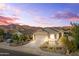 Charming single-story home with desert landscaping, mountain views, and an attached two-car garage at 7577 S Towel Creek Dr, Gold Canyon, AZ 85118