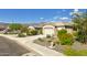 Charming single-story home with a desert landscape and two-car garage at 7577 S Towel Creek Dr, Gold Canyon, AZ 85118