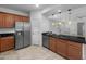 Updated kitchen with stainless steel appliances, dark countertops, and maple cabinets at 7577 S Towel Creek Dr, Gold Canyon, AZ 85118