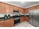 Stylish kitchen featuring stainless steel appliances, granite counters, and maple cabinets at 7577 S Towel Creek Dr, Gold Canyon, AZ 85118