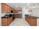 Modern kitchen featuring stainless steel appliances, dark countertops, and ample wood cabinetry at 7577 S Towel Creek Dr, Gold Canyon, AZ 85118