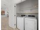 Laundry room featuring a washer and dryer, with overhead shelving at 7577 S Towel Creek Dr, Gold Canyon, AZ 85118