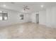 Bright, open-concept living room with tile floors, neutral walls, and plenty of natural light at 7577 S Towel Creek Dr, Gold Canyon, AZ 85118