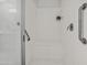 Modern shower with a built-in bench, grab bars, and a glass enclosure for accessibility and style at 7577 S Towel Creek Dr, Gold Canyon, AZ 85118