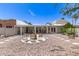 Inviting backyard with desert landscaping, covered patio, and outdoor seating area at 7736 E Rancho Vista Dr, Scottsdale, AZ 85251