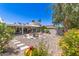 Backyard featuring desert landscaping, outdoor patio, seating area, and desert foliage at 7736 E Rancho Vista Dr, Scottsdale, AZ 85251